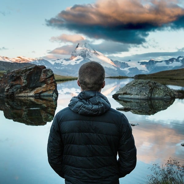 man in front of mountain lake- Things to Do in Williams Lake