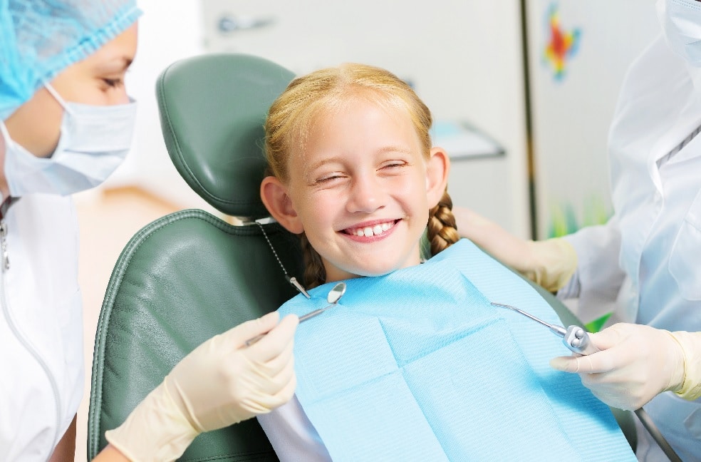 Child receiving a dental checkup