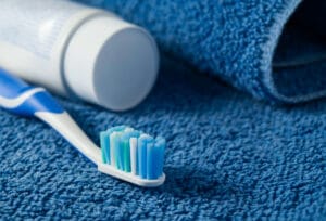 toothbrush and toothpaste for dental implant care